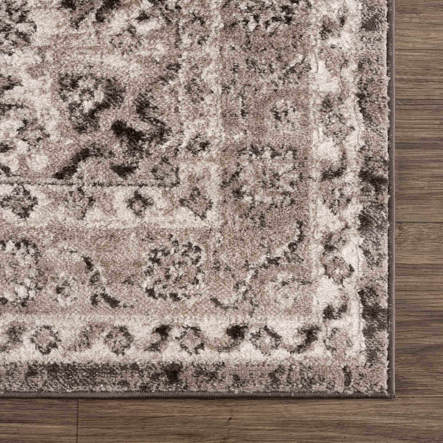 Close-up of Albie Charcoal & Beige Area Rug showing its traditional floral pattern, soft texture, and neutral color palette. Swatch
