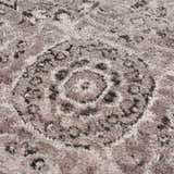 Close-up of the Albie Charcoal & Beige Area Rug showing its traditional medallion pattern and soft, textured pile. Texture