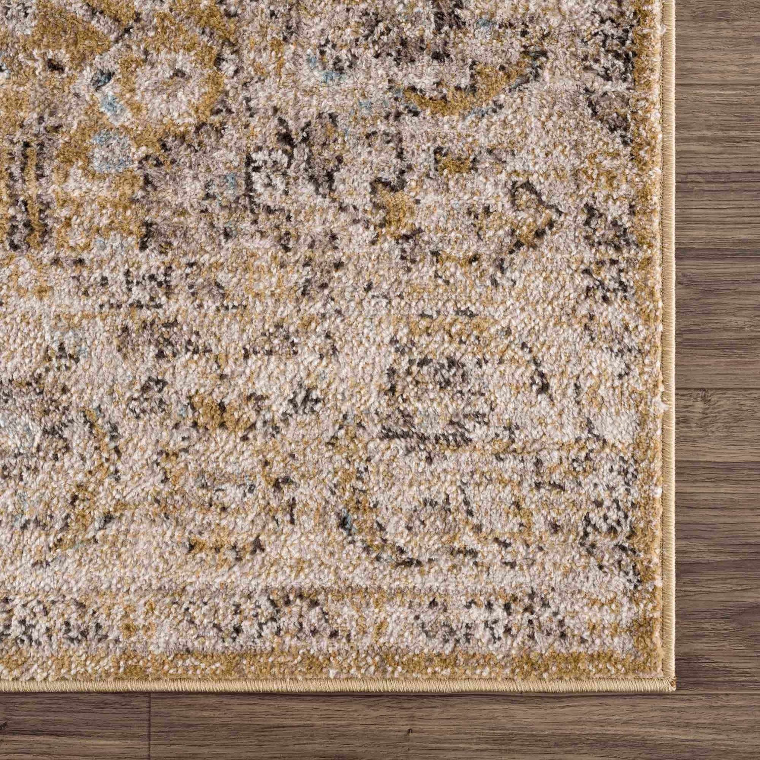 Close-up of Anana Gold & Beige Area Rug showing its traditional pattern, texture, and gold and light beige colors. Swatch