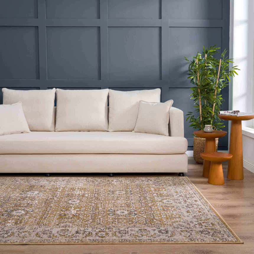 Living room scene with beige sofa, wood side tables, and Anana Gold & Beige Area Rug. Roomscene-Rectangle