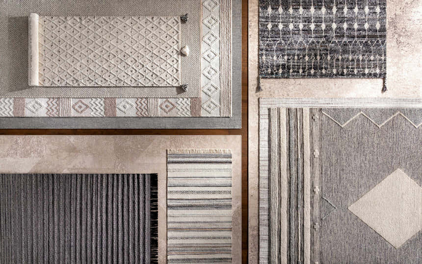 Close-up of Erina Premium Rugs in black, charcoal, cream, and gray. Bohemian, farmhouse, and contemporary styles. Styleshot