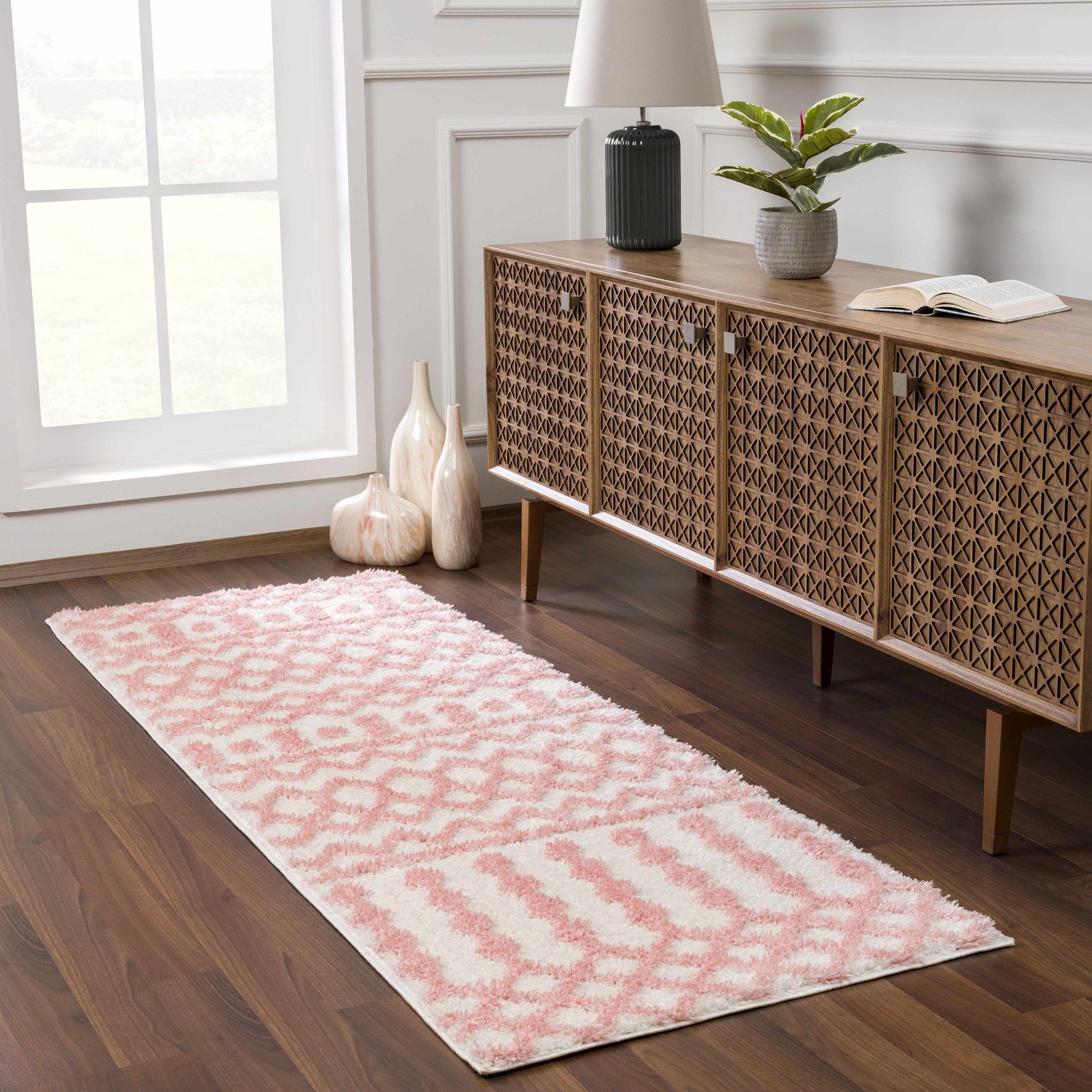 Entryway with a Darva Pink Plush Area Carpet, wood console table, and white walls. Roomscene-Runner