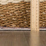 Close-up of Isugod Washable Area Rug showing rug thickness next to a ruler. Beige, brick red, and ivory colors visible. Pile