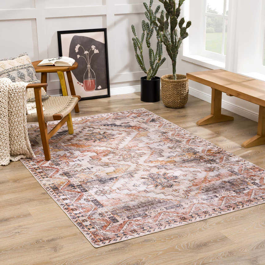 Living room scene with the Isugod Washable Area Rug in beige, brick red, and black, styled with a chair and wooden bench. Roomscene-Rectangle
