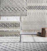 Close-up of Limoges Area Carpet showing geometric patterns, hand woven texture, black and cream colors. Styleshot