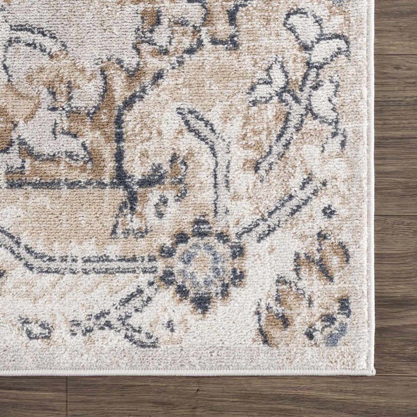 Close-up of the Mudgee Area Rug showing its charcoal, cream, and tan oriental pattern and soft, textured weave. Swatch