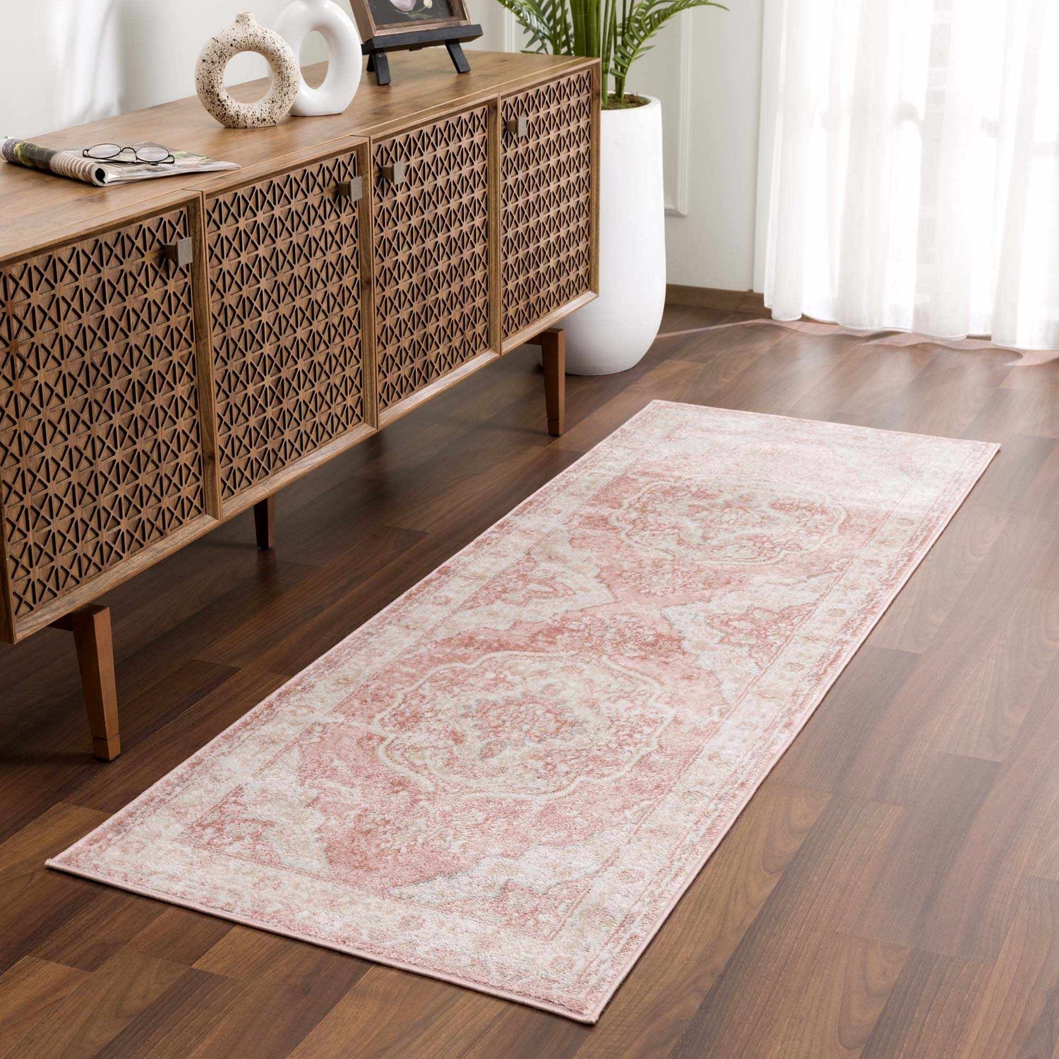 Hallway scene with a Kandos Blush & Light Pink Area Rug, wood console table, and hardwood floors. Neutral, warm, inviting. Roomscene-Runner