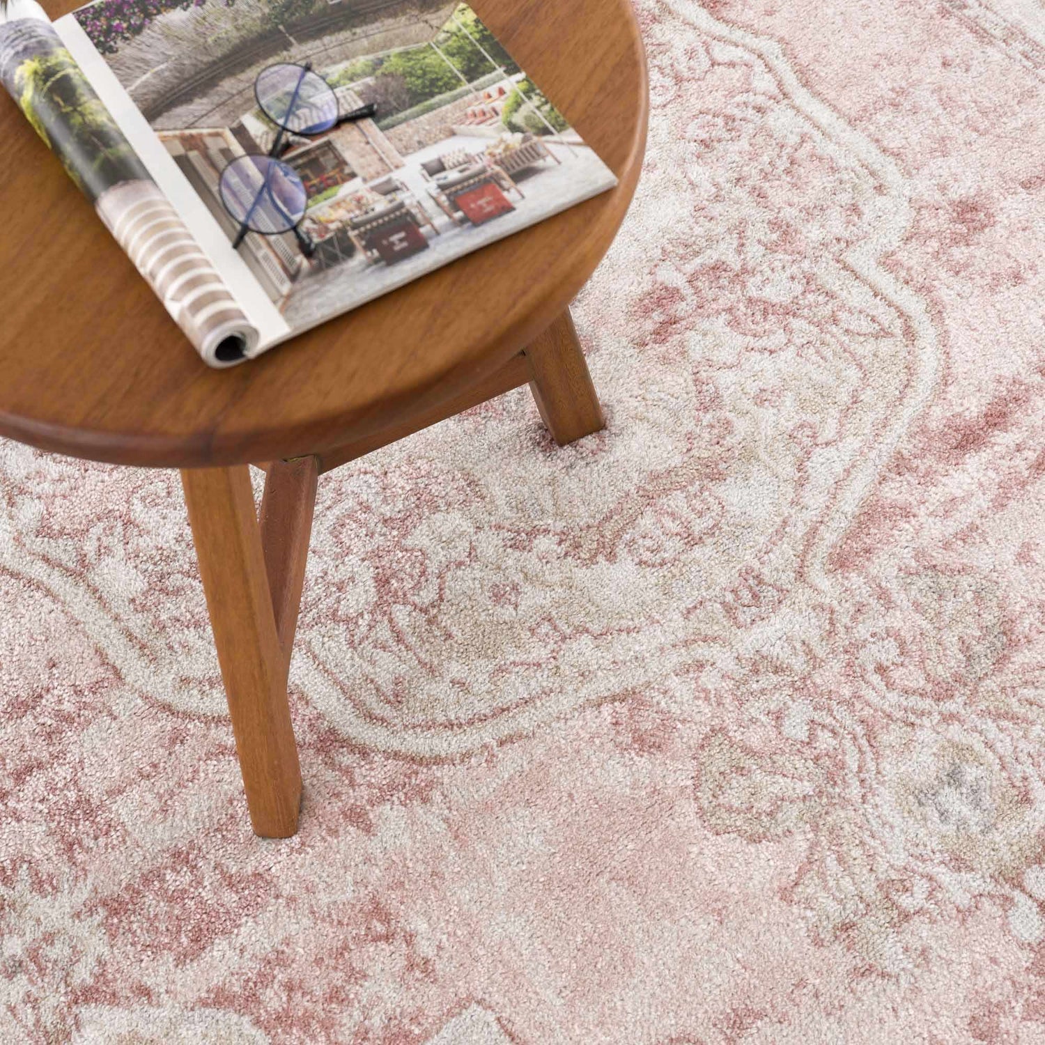 Close-up of the Kandos Blush & Light Pink Area Rug showing its cream, beige, and pink traditional pattern and soft texture. Styleshot