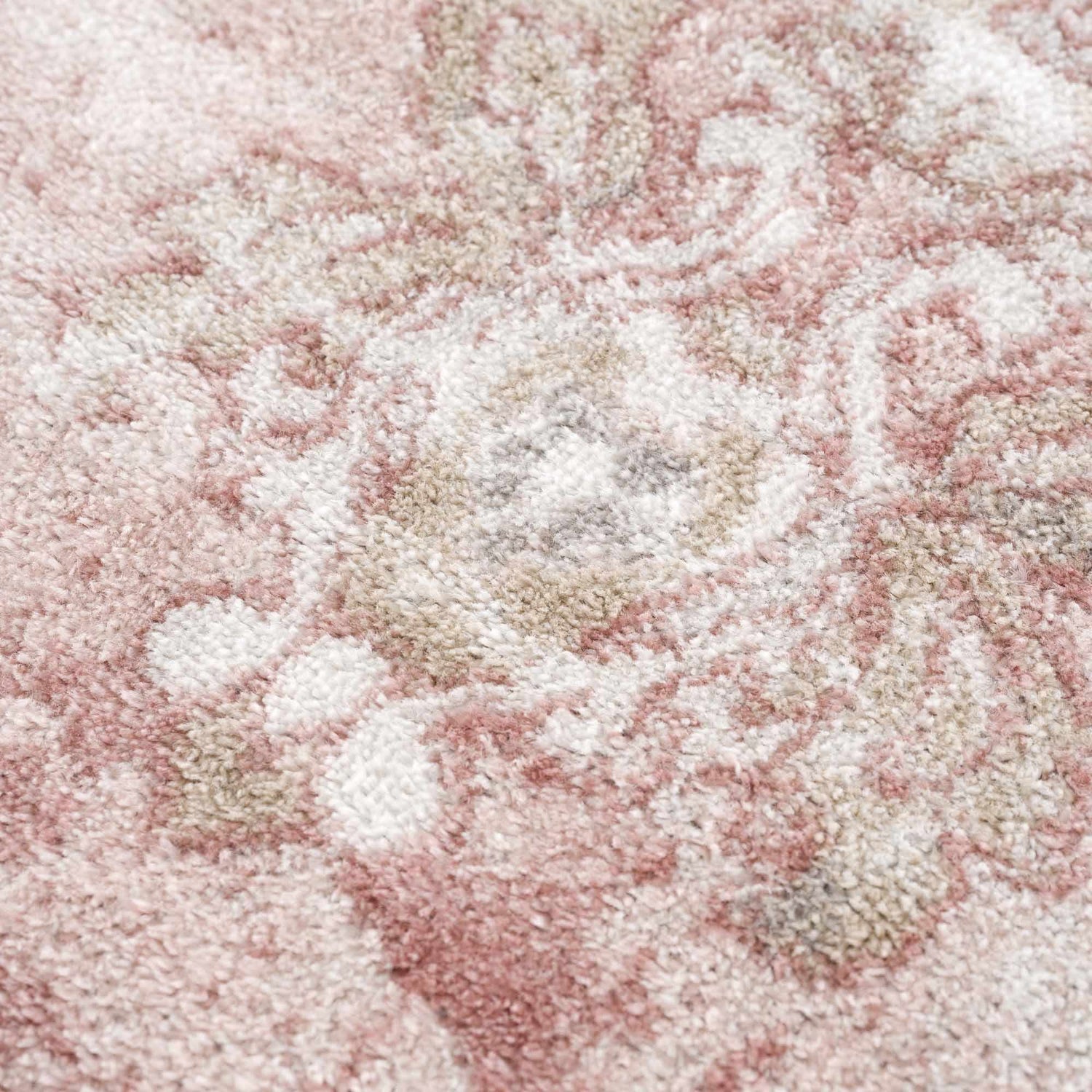 Close-up of the Kandos Blush & Light Pink Area Rug, showing its soft texture and cream, beige, and pale pink oriental pattern. Texture