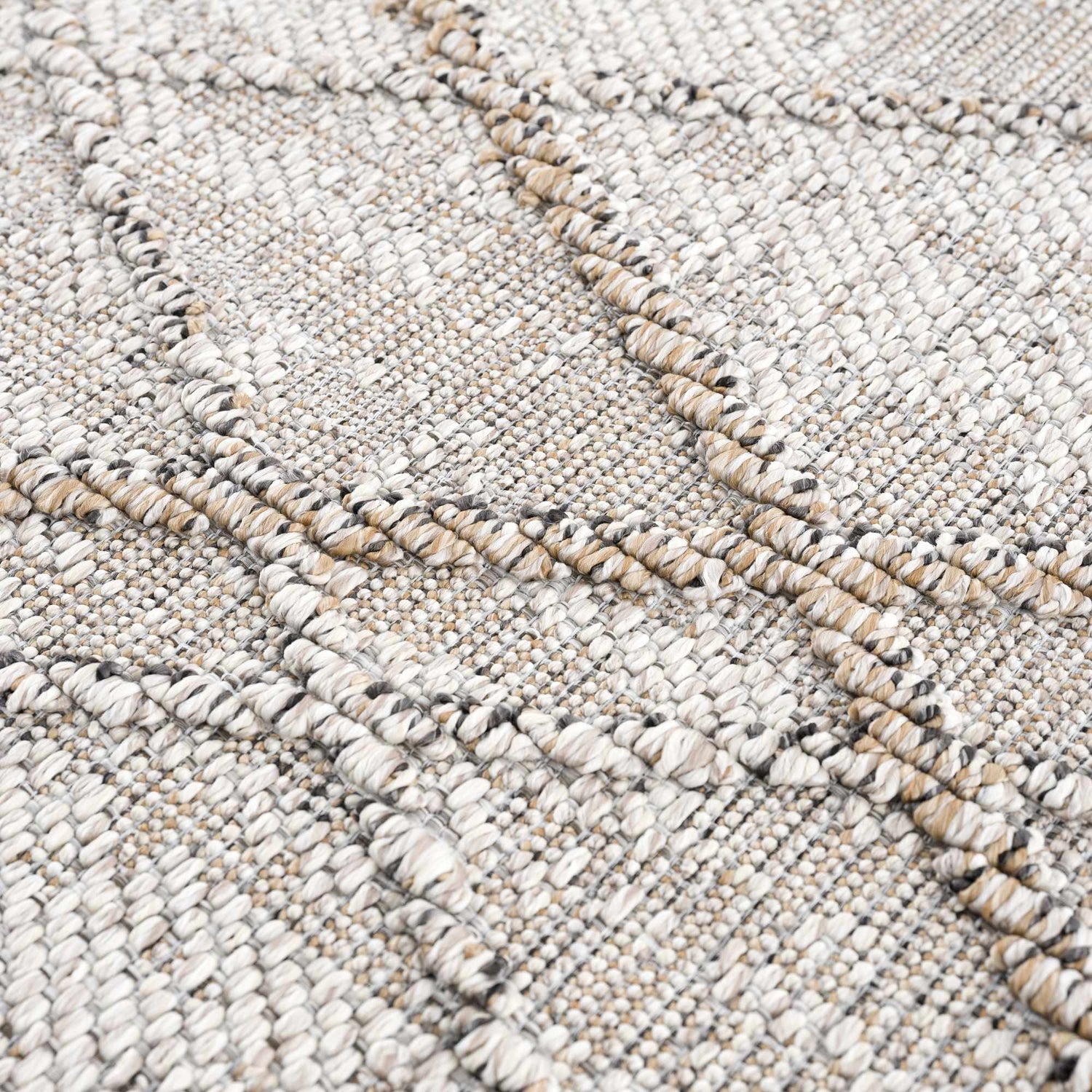 Close-up of the Baqer Bone & Tan Textured Performance Rug, showing its woven texture and neutral bone and tan colors. Texture