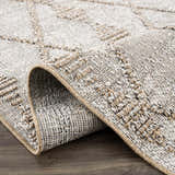 Close-up of Nyla Bone & Tan Textured Performance Rug showing woven texture and geometric pattern. Farmhouse style. Fold