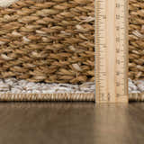 Close-up of the textured weave and pile height of the Nyla Bone & Tan Performance Rug. Pile