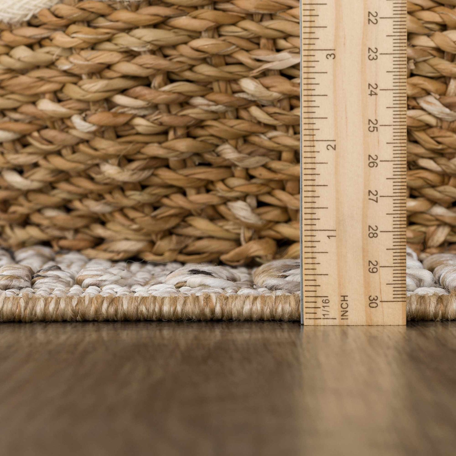 Close-up of the textured weave and pile height of the Nyla Bone & Tan Performance Rug. Pile