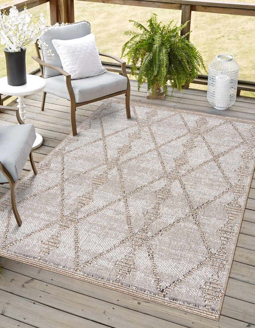 Outdoor patio scene with Nyla Bone & Tan Textured Performance Rug, gray chairs, white accents, and wood decking. Roomscene-Rectangle