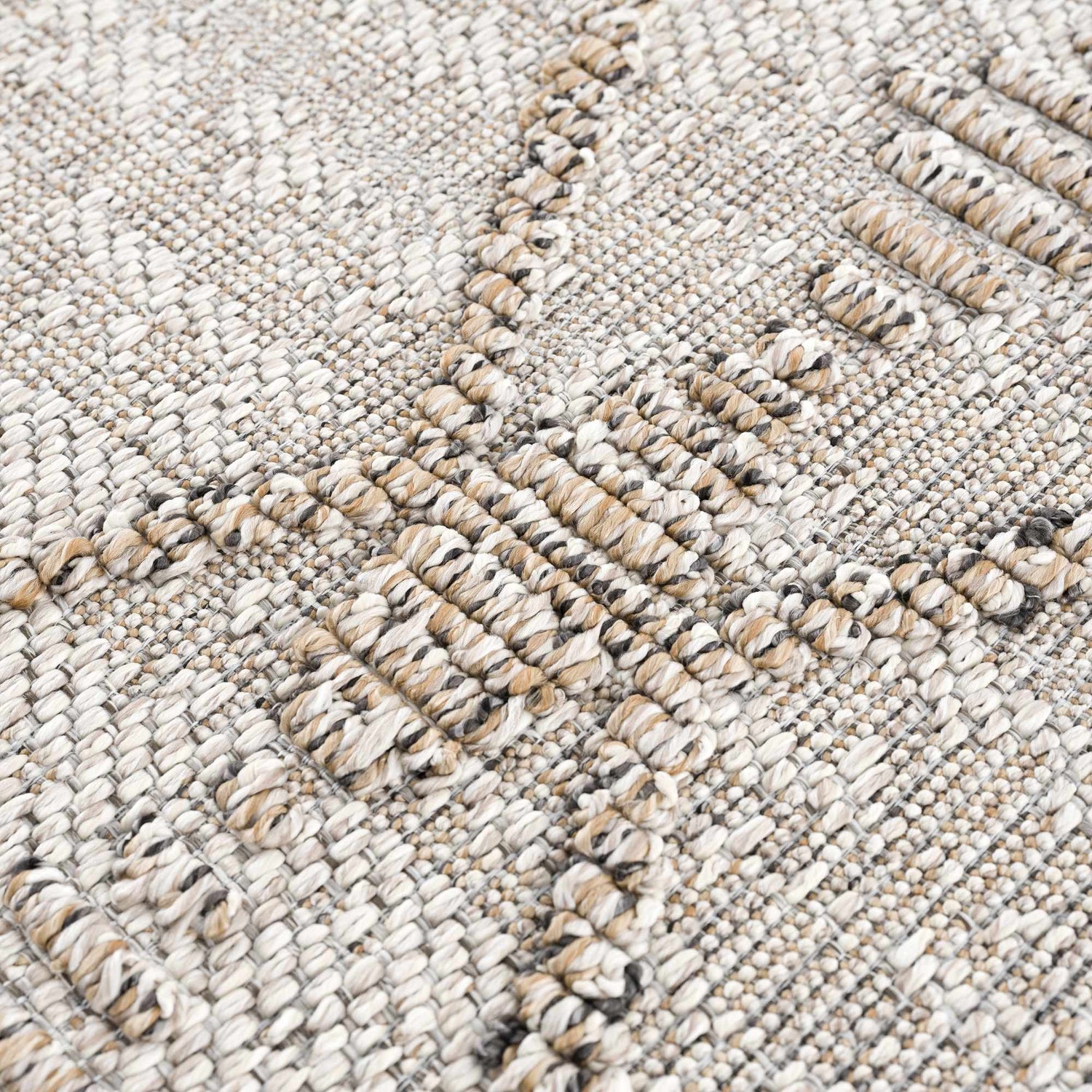 Close-up of the textured Nyla Bone & Tan Performance Rug, showing woven bone, tan, and gray yarns. Texture