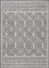 Close-up of the Diah Black & Bone Area Rug, featuring a geometric diamond pattern and decorative borders. Design-Rectangle-46