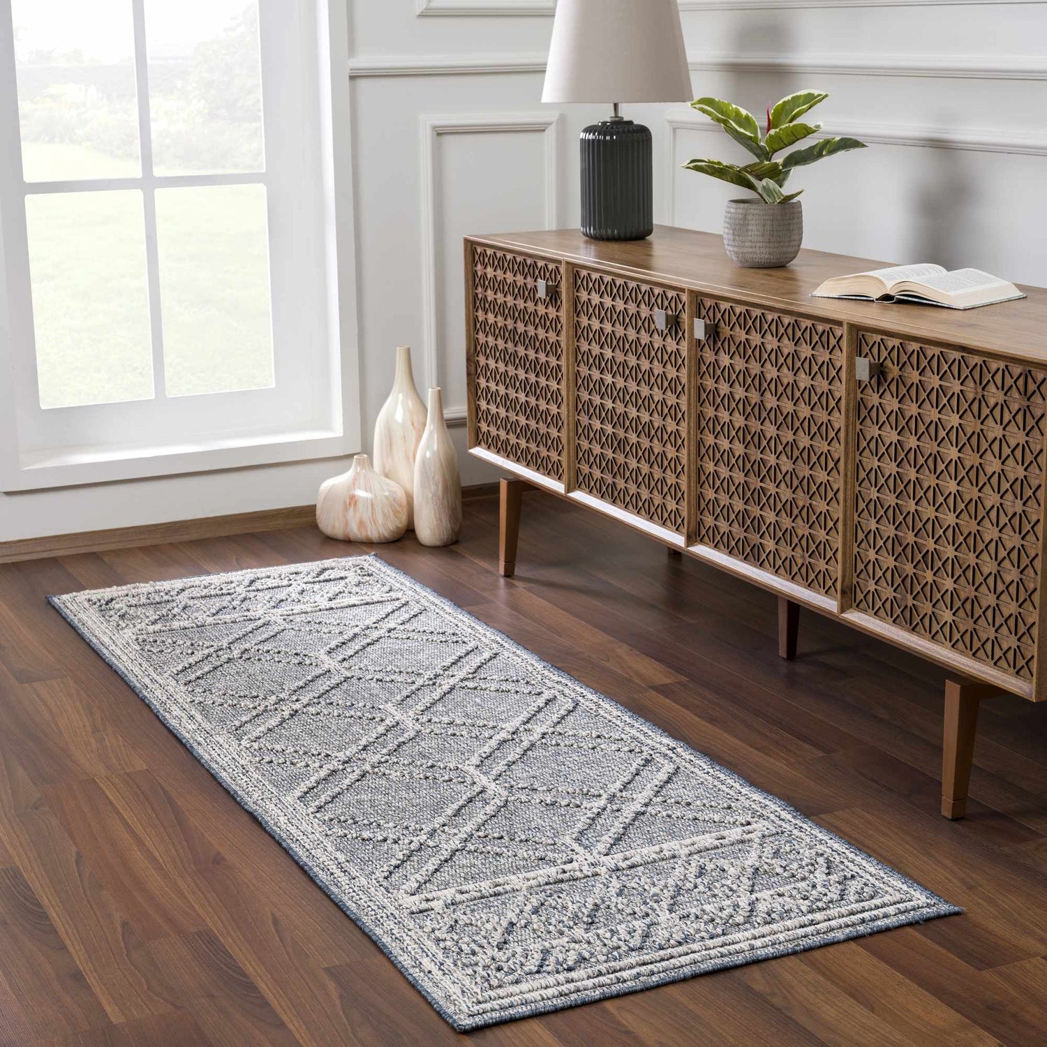 Entryway with Diah Gray Blue & Bone Area Rug runner, wood console table, vases, and natural light. Roomscene-Runner