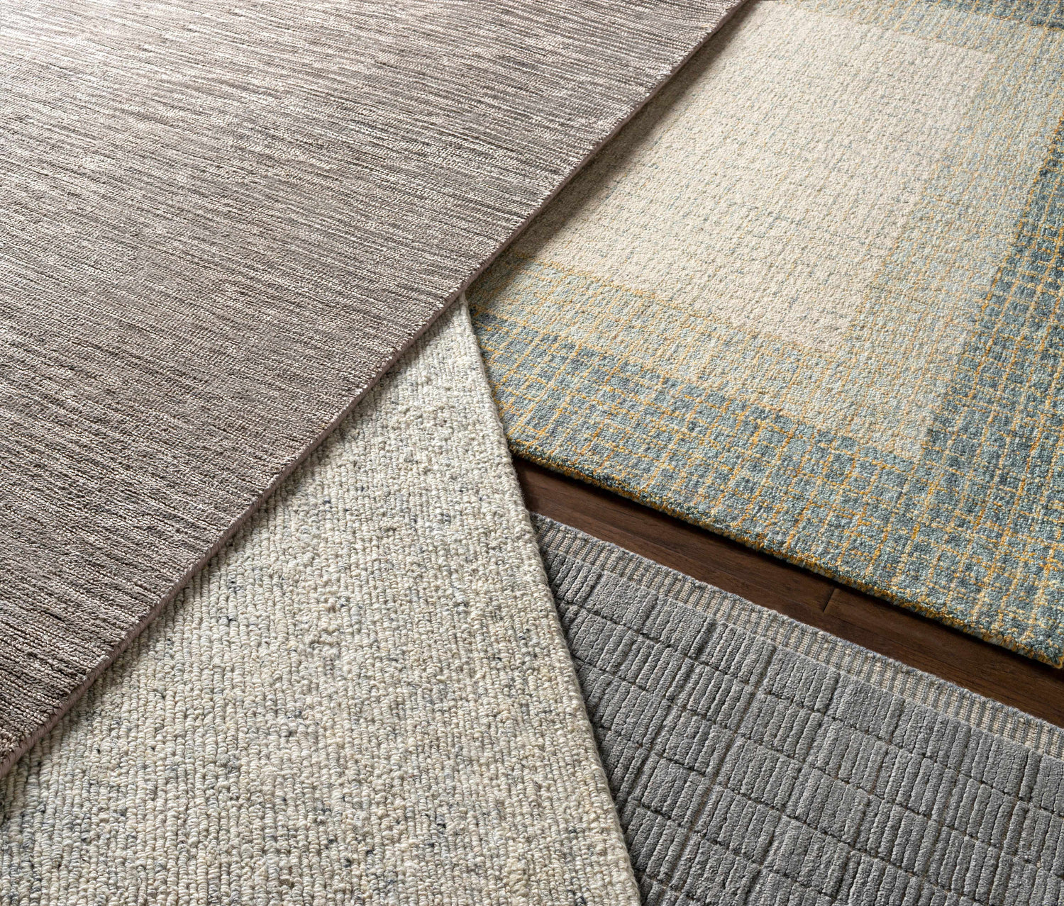 Close-up of various Pualas Area Rug textures and colors: cream, sage, beige, and olive wool rugs. Styleshot