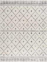 Close-up of Tigris Area Rug, a machine-woven rug with a geometric diamond pattern in charcoal gray and white. Design-Rectangle-5373