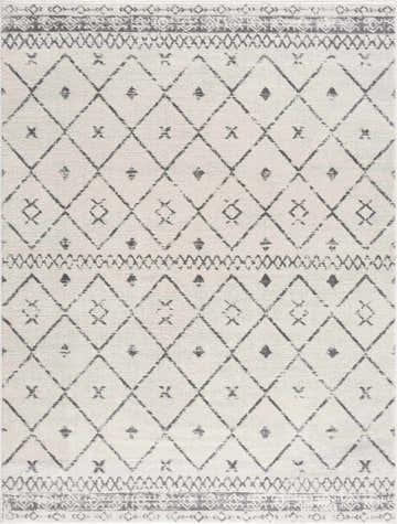Close-up of Tigris Area Rug, a machine-woven rug with a geometric diamond pattern in charcoal gray and white. Design-Rectangle-5373