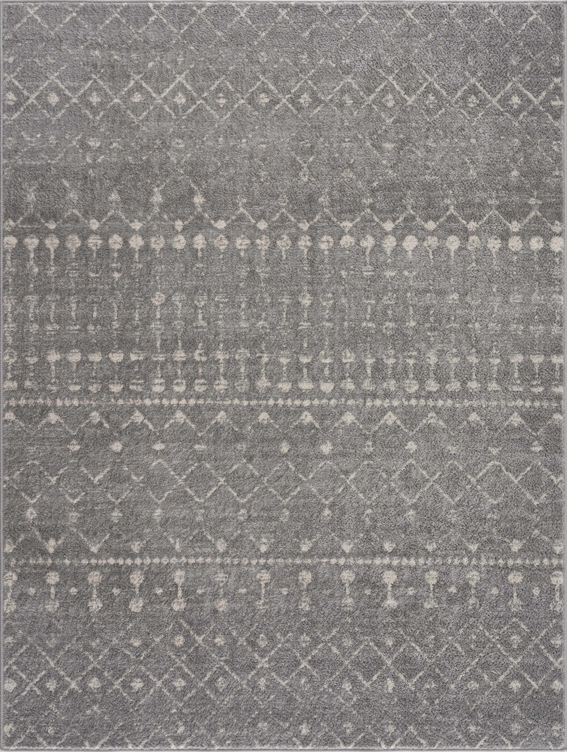 Close-up of the Tigrican Light Gray 2334 Area Rug showing a geometric ivory pattern on a textured gray background. Design-Rectangle
