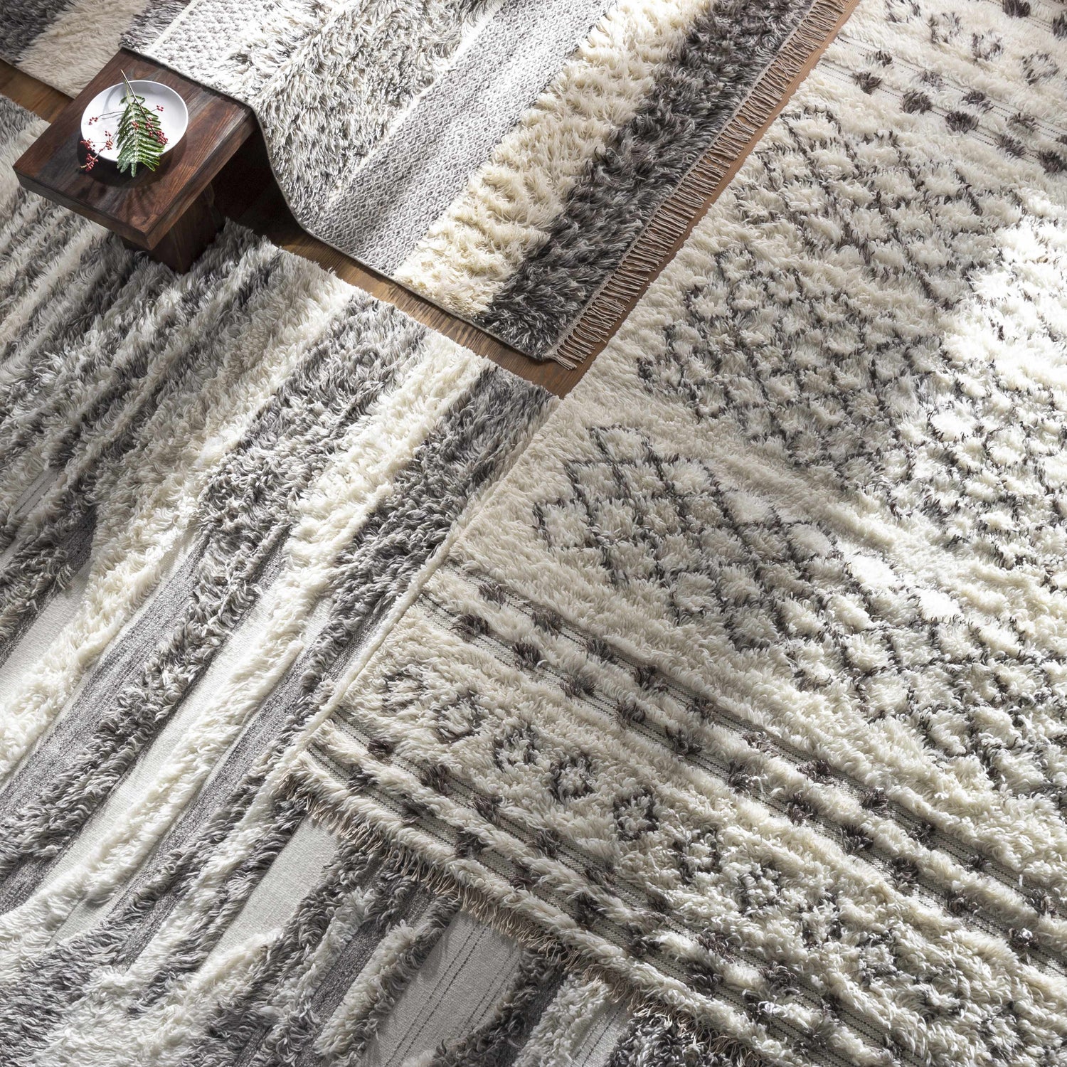 Close-up of the Lochwinnoch Area Rug showing its beige, gray, and brown Moroccan shag design and hand-woven texture. Styleshot