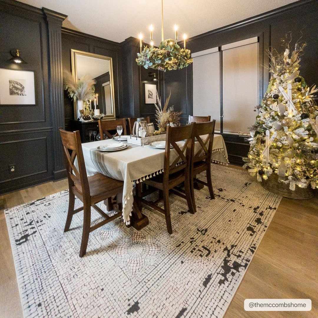 Dark and moody dining room with a Christmas tree and the beige Terlingua Area Rug. Roomscene-Rectangle