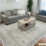 Living room scene with gray sofas and Tigried Ivory & Gray 2323 Area Rug. The rug has a traditional, bohemian pattern. Roomscene-Rectangle