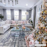 Living room with Christmas tree and Tonalea Carved Statement Area Rug in blue, gray, and ivory tones. Roomscene-Rectangle