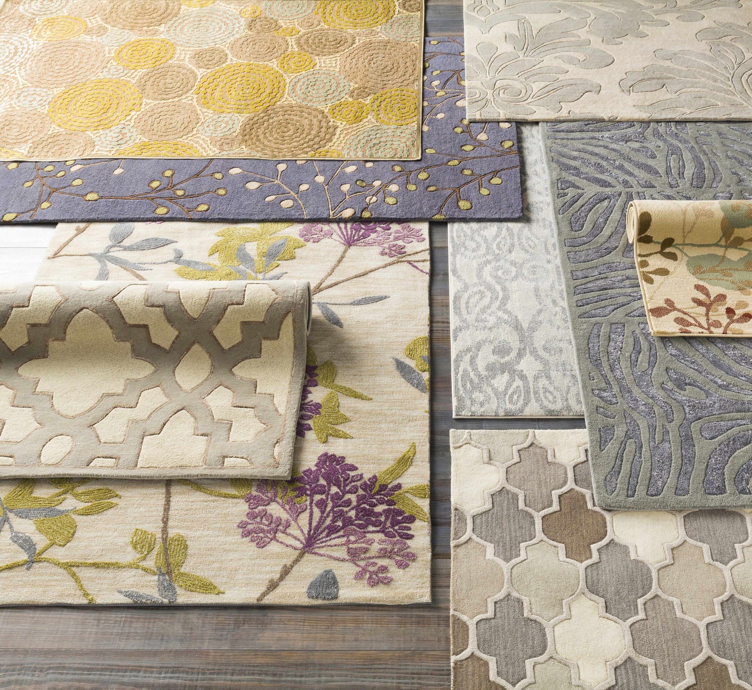 Assorted Cementon Area Rugs on display: wool rugs in gray, ivory, floral, geometric, and contemporary designs. Styleshot