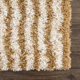 Close-up of a Calup Shag Area Rug. Bone and dark brown stripes create a soft, textured, geometric pattern. Swatch