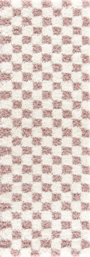 Close-up of the Atira Pink Checkered Shag Rug. Cream and rose gold squares create a soft, textured checkerboard pattern. Design-Runner-2773