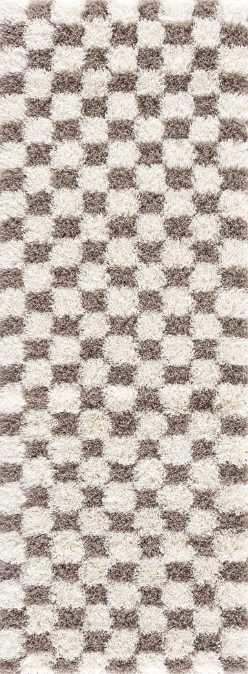Close-up of the Atira Brown Checkered Area Rug. Shag rug with a geometric brown and cream checker pattern. Design-Runner-2773
