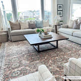 Living room scene with a Flat Pile Urpi Red Washable Rug, gray sofas, and a dark wood coffee table. Roomscene-Rectangle