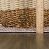 Close-up of the Keola Washable Area Rug showing its texture, pile height with a ruler, and woven edge detail. Pile