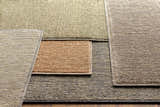 Close-up of hand-loomed Vezirhan Area Rug in dark red, peach, cotton & wool. Contemporary rectangle rug texture. Styleshot