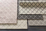 Close-up of Kanopolis Carpet in black, cream, medium gray. Hand woven wool and viscose rug with a contemporary diamond pattern. Styleshot