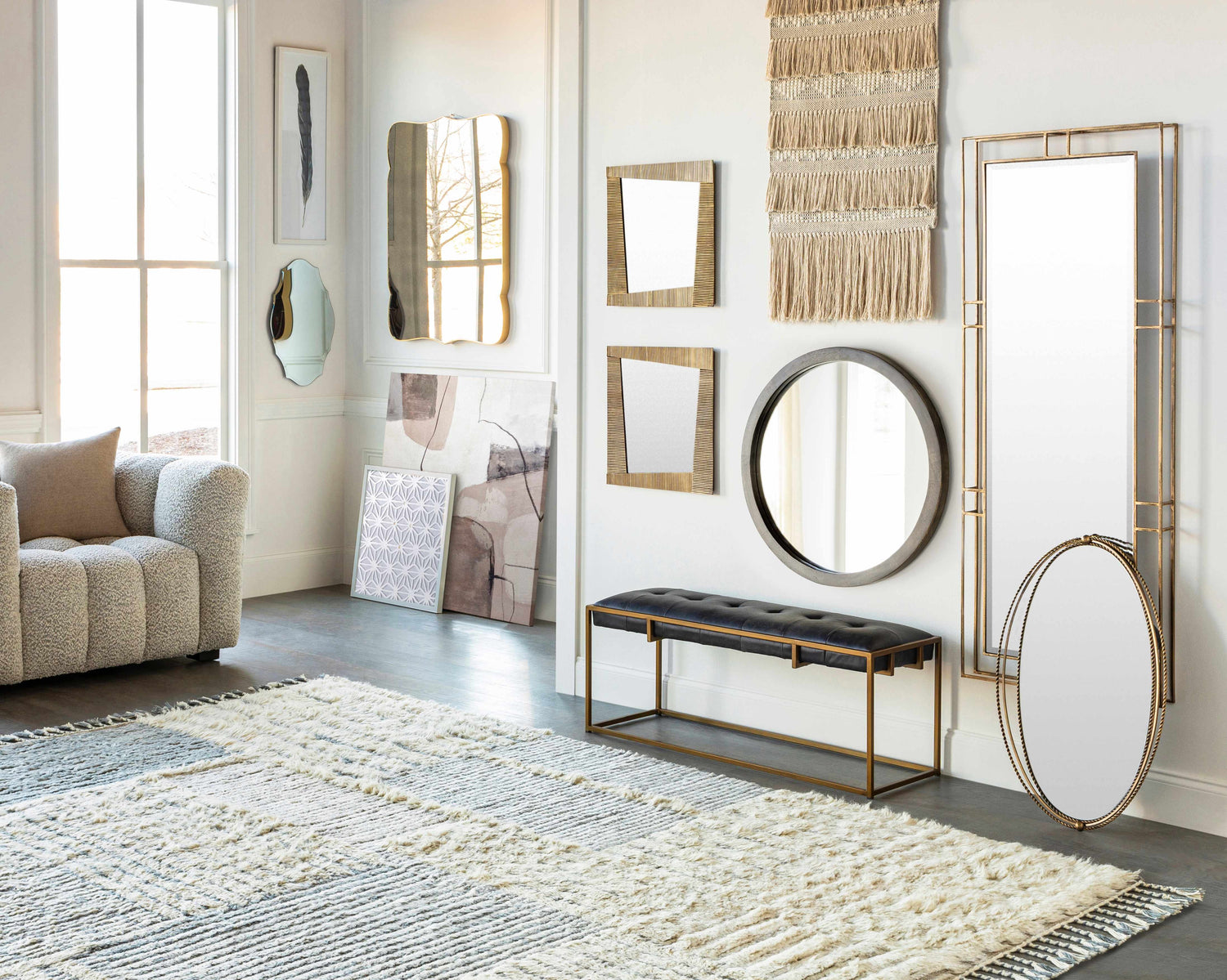 Bright living room with a textured sofa and Plean Premium Rug in cream and gray. Modern wall decor. Styleshot