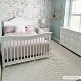 Nursery with white furniture and floral wallpaper featuring the Deron White Washable 3D Rug. Roomscene-Rectangle