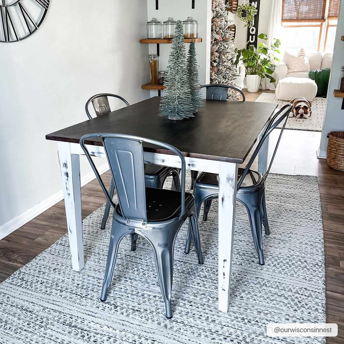 Farmhouse dining room with a black table and the cream and black Williford Wool Area Rug. Roomscene-Rectangle