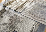 Close-up of Limoges Area Carpet Clearance rugs in black, cream, and gray with geometric, striped, and woven textures. Styleshot