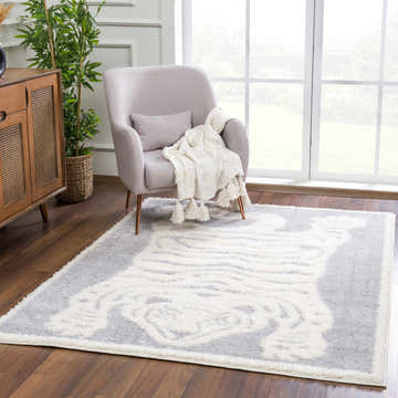 Living room scene with a cream and light gray Zane Gray Tibetan Tiger Area Rug. Roomscene-Rectangle