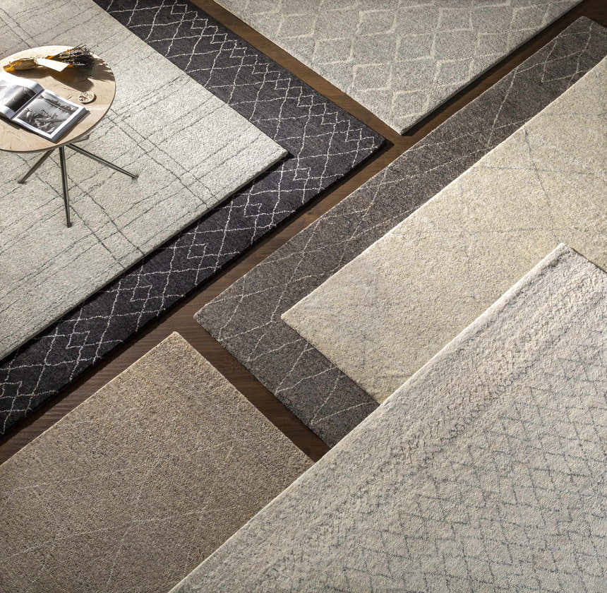 Overhead view of Anito Premium Rugs in charcoal, gray, and light gray with contemporary, farmhouse, and transitional styles. Styleshot