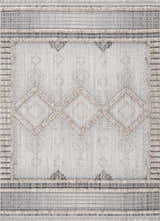 Close-up of the Amaga High-Low Rustic Rug. Geometric design in charcoal, cream, light beige, and gray tones. Textured polyester. Design-Rectangle-537