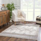 Living room scene with Amaga High-Low Rustic Rug, cream chair, wood cabinet, and neutral decor for a cozy, contemporary vibe. Roomscene-Rectangle