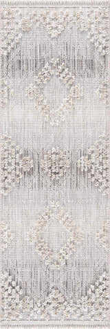 Close-up of the Poydras High-Low Rustic Rug. Charcoal, gray, and light beige rug with a textured diamond pattern. Design-Runner-2773