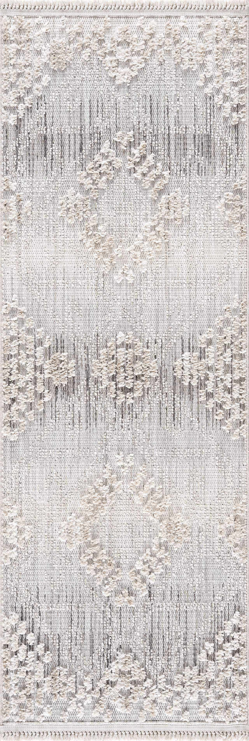 Close-up of the Poydras High-Low Rustic Rug. Charcoal, gray, and light beige rug with a textured diamond pattern. Design-Runner-2773