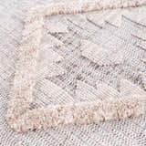 Close-up of the Serkomen High-Low Area Rug showing its textured, geometric design and neutral color palette. Texture