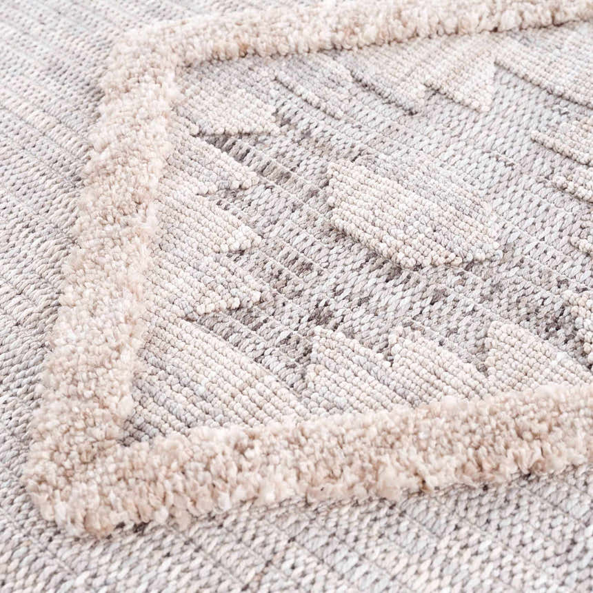 Close-up of the Serkomen High-Low Area Rug showing its textured, geometric design and neutral color palette. Texture