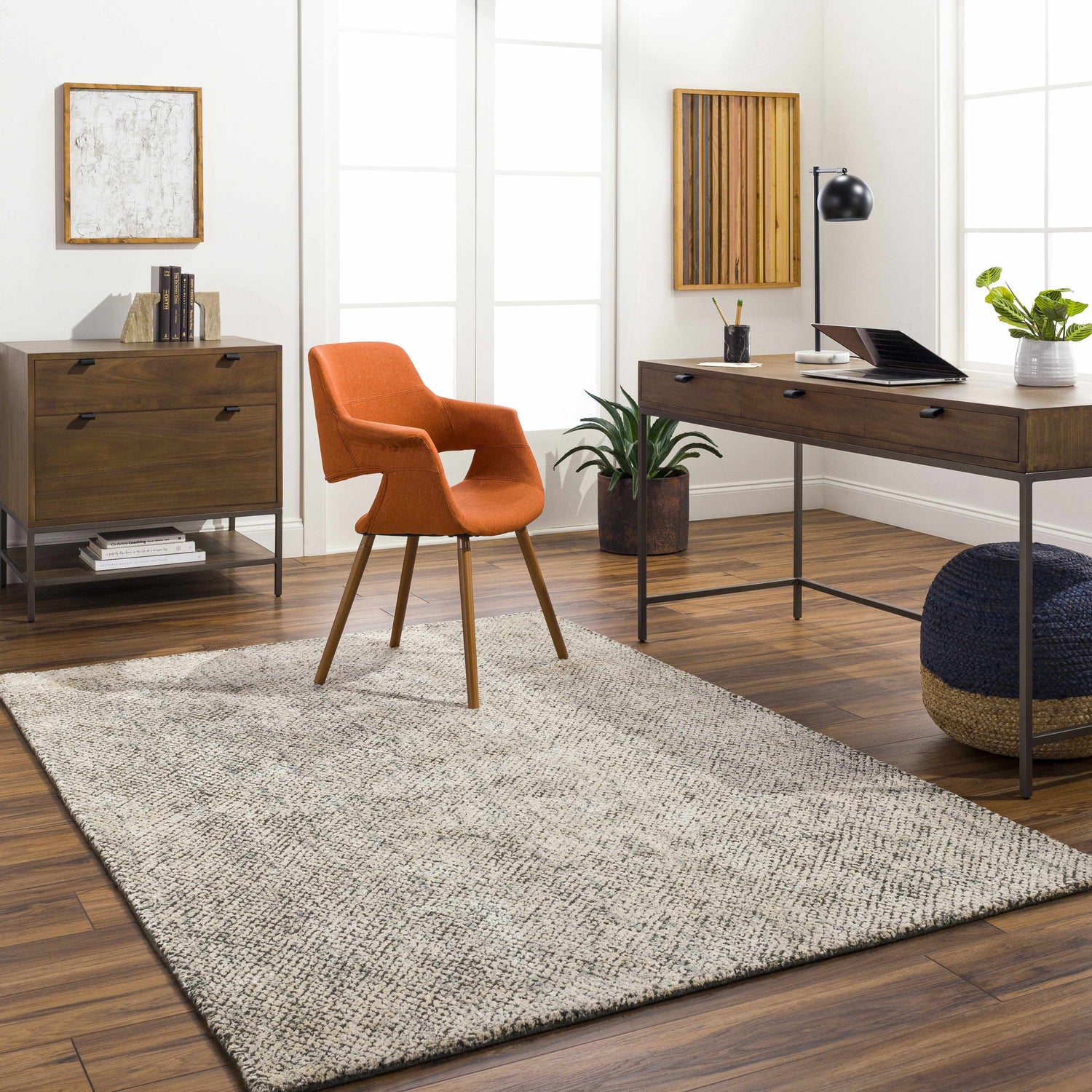 Contemporary home office with wood desk, orange chair, and beige Abiba Area Rug. Roomscene-Rectangle